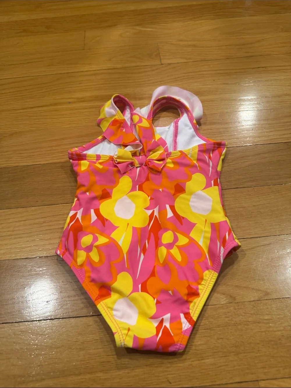 Snapper rock floral with ruffles one piece swimsuit size 18-24. Months .